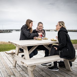 Women enjoying a picnic in the Îles de la Madeleine