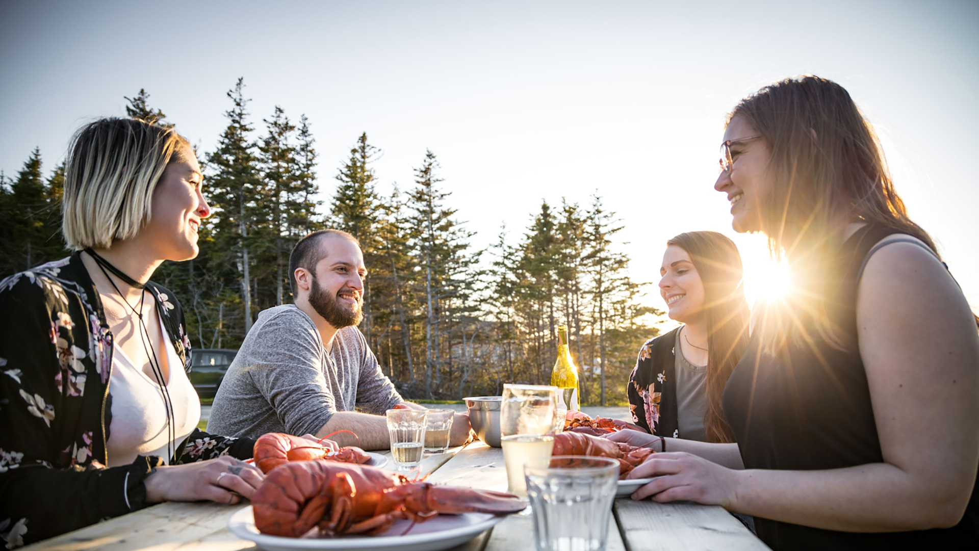 Group eating lobster in the Îles de la Madeleine