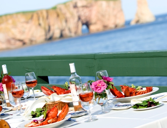 Seafood plates in front of Percé Rock