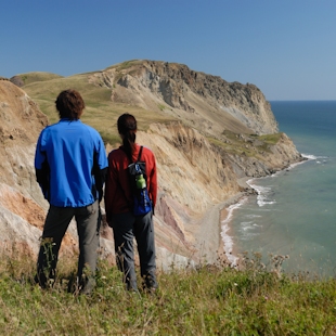 Couple admiring the cliffs on the Islands