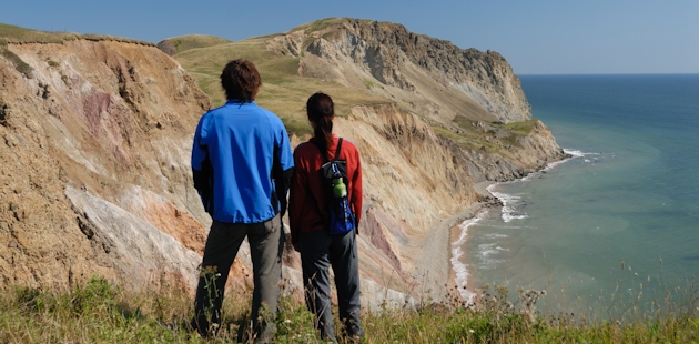 Couple admiring the cliffs on the Islands