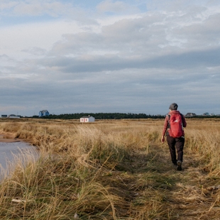 Woman hiking in the Îles de la Madeleine in the fall