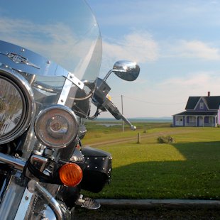 Motorcycle parked in front of a house