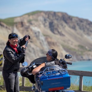 Women taking a picture in the Îles de la Madeleine