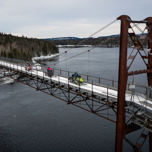 Snowmobilers on the snowmobile bridge over the Manicouagan River