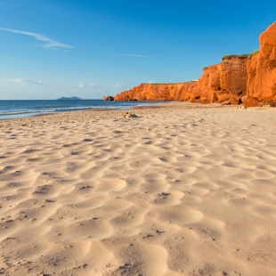 Couple on a beach in the Îles de la Madeleine