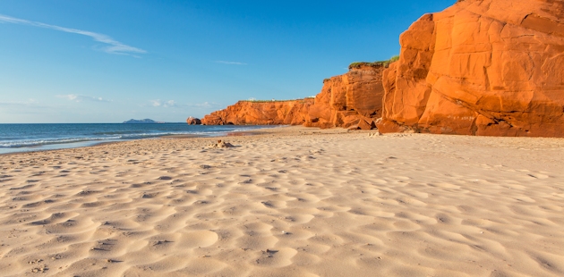 Couple on a beach in the Îles de la Madeleine