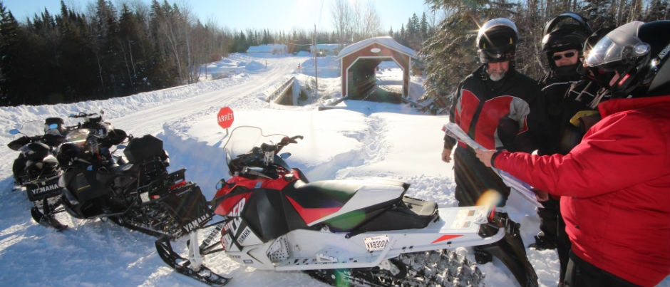 Don't forget your snowmobile trail map! - Photo Credit: Éric Marchand Preparing for a Snowmobile Trip in the Maritime Regions of Québec